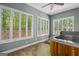 Spa room with a wooden hot tub and many windows overlooking a private backyard at 2058 Sewanee Ct, Villa Rica, GA 30180