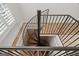 Spiral staircase with metal railings and tile steps at 2058 Sewanee Ct, Villa Rica, GA 30180