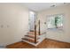 Cozy stairwell with hardwood steps and railing, connecting different levels of the home at 2058 Sewanee Ct, Villa Rica, GA 30180