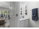 Half bathroom featuring neutral colors and framed decor at 11255 Wittenridge Dr, Alpharetta, GA 30022