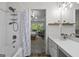 Bathroom showcasing the shower, vanity, and view into the main bedroom at 11255 Wittenridge Dr, Alpharetta, GA 30022
