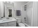 Clean bathroom features a vanity, a toilet, a shower with white subway tile surround, and sleek fixtures at 11255 Wittenridge Dr, Alpharetta, GA 30022