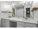 Double sink bathroom with neutral walls and a large mirror at 11255 Wittenridge Dr, Alpharetta, GA 30022