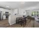 Open-concept dining area next to a modern kitchen, creating a seamless and social living space at 11255 Wittenridge Dr, Alpharetta, GA 30022
