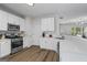 Bright kitchen featuring white cabinets, stainless appliances, and subway tile backsplash at 11255 Wittenridge Dr, Alpharetta, GA 30022