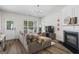 Open concept living room with plenty of natural light and stylish furnishings, ideal for entertaining at 11255 Wittenridge Dr, Alpharetta, GA 30022