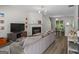 Modern living room with a cozy fireplace, sleek furniture, and plenty of natural light at 11255 Wittenridge Dr, Alpharetta, GA 30022