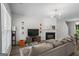 Bright and airy living room featuring a fireplace, modern decor, and comfortable seating at 11255 Wittenridge Dr, Alpharetta, GA 30022
