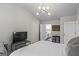 Bright main bedroom with ensuite bathroom and comfortable furnishings at 11255 Wittenridge Dr, Alpharetta, GA 30022