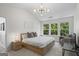Main bedroom with a vaulted ceiling, light-colored walls, and large windows at 11255 Wittenridge Dr, Alpharetta, GA 30022