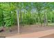 View of serene, wooded backyard from the back deck, highlighting the property's privacy at 480 Holly Hills Ln, Mcdonough, GA 30252