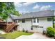 Spacious backyard featuring a large deck, walkout basement, two car garage and well-maintained lawn at 480 Holly Hills Ln, Mcdonough, GA 30252