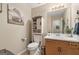 Half-bathroom with decorative cabinet, artwork, and attractive design elements at 480 Holly Hills Ln, Mcdonough, GA 30252
