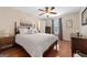 Bedroom with hardwood floors, ceiling fan, and plenty of natural light at 480 Holly Hills Ln, Mcdonough, GA 30252