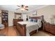 Bedroom featuring wood floors, a ceiling fan, and natural light at 480 Holly Hills Ln, Mcdonough, GA 30252