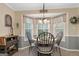 Bright and airy breakfast nook with bay window and decorative light fixture at 480 Holly Hills Ln, Mcdonough, GA 30252