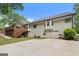 Rear exterior of home with white siding, two-car garage, and a spacious back deck at 480 Holly Hills Ln, Mcdonough, GA 30252