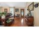 Elegant foyer with rich hardwood flooring and an ornate front door at 480 Holly Hills Ln, Mcdonough, GA 30252