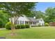 Lovely home with a charming front porch and beautifully landscaped yard at 480 Holly Hills Ln, Mcdonough, GA 30252