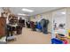 Carpeted office space with two desks, storage and multiple computers at 480 Holly Hills Ln, Mcdonough, GA 30252