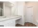 Well-lit bathroom showcasing granite countertops, vinyl flooring, and white cabinets at 279 Oliver Dr, Locust Grove, GA 30248