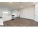 Open-concept kitchen features modern appliances, sleek countertops, and stylish flooring at 279 Oliver Dr, Locust Grove, GA 30248