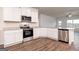 Stylish kitchen with stainless steel appliances, sleek countertops, and lots of cabinet space at 279 Oliver Dr, Locust Grove, GA 30248