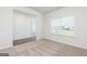 Bright living room with plush carpet and a large window offering plenty of natural light at 279 Oliver Dr, Locust Grove, GA 30248