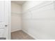 Empty walk-in closet with a wire shelf and neutral carpeting at 279 Oliver Dr, Locust Grove, GA 30248