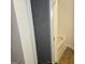 An open closet with wire shelving near a tub with tile surround at 547 Se Tufton Se Trl, Atlanta, GA 30354