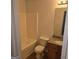 Bathroom with a tub/shower combo, toilet, and granite-topped vanity at 547 Se Tufton Se Trl, Atlanta, GA 30354