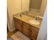 Bathroom with vanity, stone-look counter, and mirror with a view of the soaking tub at 547 Se Tufton Se Trl, Atlanta, GA 30354