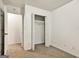 Neutral bedroom featuring an open closet and doorway leading to another room at 547 Se Tufton Se Trl, Atlanta, GA 30354