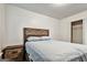 Cozy bedroom featuring a custom wooden bed frame and matching nightstand at 547 Se Tufton Se Trl, Atlanta, GA 30354