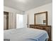 Comfortable bedroom showcasing a wooden dresser with mirror and a matching bed frame at 547 Se Tufton Se Trl, Atlanta, GA 30354
