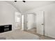 A bedroom leading to another room featuring neutral carpet and a ceiling fan at 547 Se Tufton Se Trl, Atlanta, GA 30354
