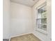 Carpeted walk-in closet features a window, providing natural light at 547 Se Tufton Se Trl, Atlanta, GA 30354