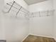 Walk-in closet with carpet and wire shelving for optimal storage solutions at 547 Se Tufton Se Trl, Atlanta, GA 30354