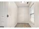A walk-in closet features carpeted flooring and a window for natural light at 547 Se Tufton Se Trl, Atlanta, GA 30354