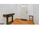 Entryway with hardwood floors and a white front door with decorative window at 547 Se Tufton Se Trl, Atlanta, GA 30354