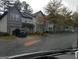 A row of townhomes with stone accents, garages, and manicured lawns, offering suburban living at 547 Se Tufton Se Trl, Atlanta, GA 30354