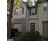 Charming townhome featuring stone accents, neutral siding, and a well-maintained front yard with lush greenery at 547 Se Tufton Se Trl, Atlanta, GA 30354