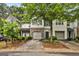 Charming townhome showcasing well-maintained landscaping and attached garages for convenient parking at 547 Se Tufton Se Trl, Atlanta, GA 30354