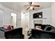 Cozy living room features a fireplace, ceiling fan, and neutral color palette at 547 Se Tufton Se Trl, Atlanta, GA 30354