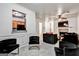 View of the open concept living area with fireplace and view into the kitchen at 547 Se Tufton Se Trl, Atlanta, GA 30354