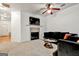 Cozy living room with a tile fireplace, ceiling fan, and comfortable seating at 547 Se Tufton Se Trl, Atlanta, GA 30354