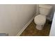 Modern toilet with a dual-flush system for water conservation in a cozy space at 547 Se Tufton Se Trl, Atlanta, GA 30354
