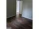 Bedroom with wood flooring and gray walls at 6260 Marbut Farms Ter, Lithonia, GA 30058