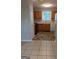 Well-lit kitchen featuring wood cabinets, a window view, and modern appliances at 6260 Marbut Farms Ter, Lithonia, GA 30058