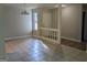 Open-concept living area featuring tile floors, a decorative chandelier and a bright window view at 6260 Marbut Farms Ter, Lithonia, GA 30058
